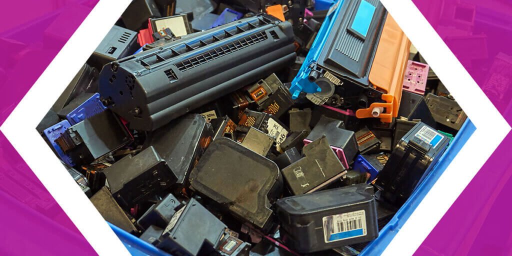 A pile of used ink and toner cartridges