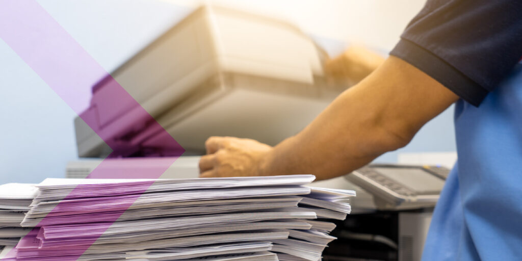 Employee waiting for the printer to load